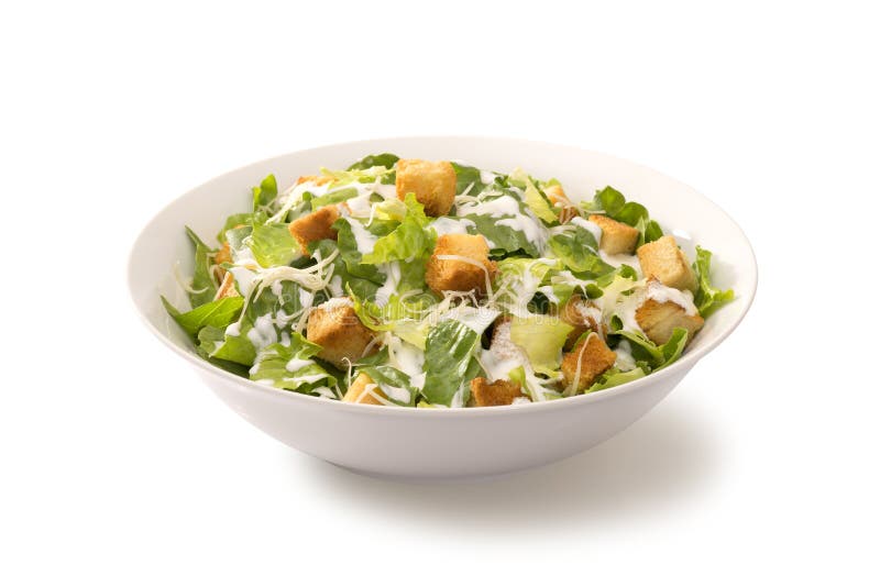 Salade de César dans un plat blanc images stock