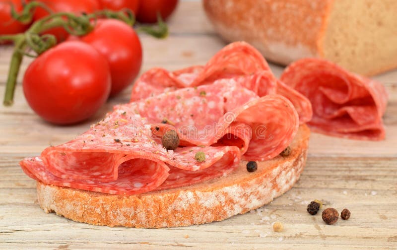 Salami slices on the bread stock image. Image of lunch 150226143
