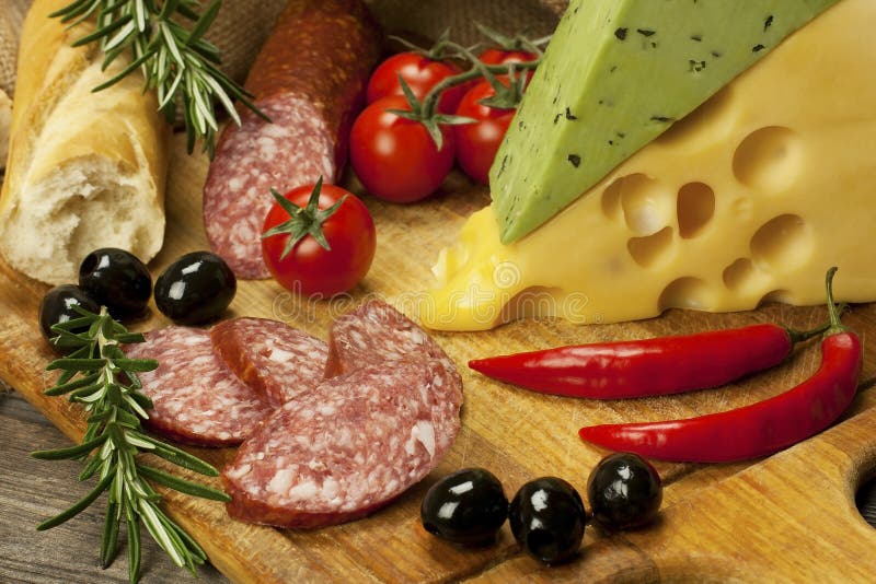 Salami and Cheese Platter with Vegetable and Herbs Stock Photo Image