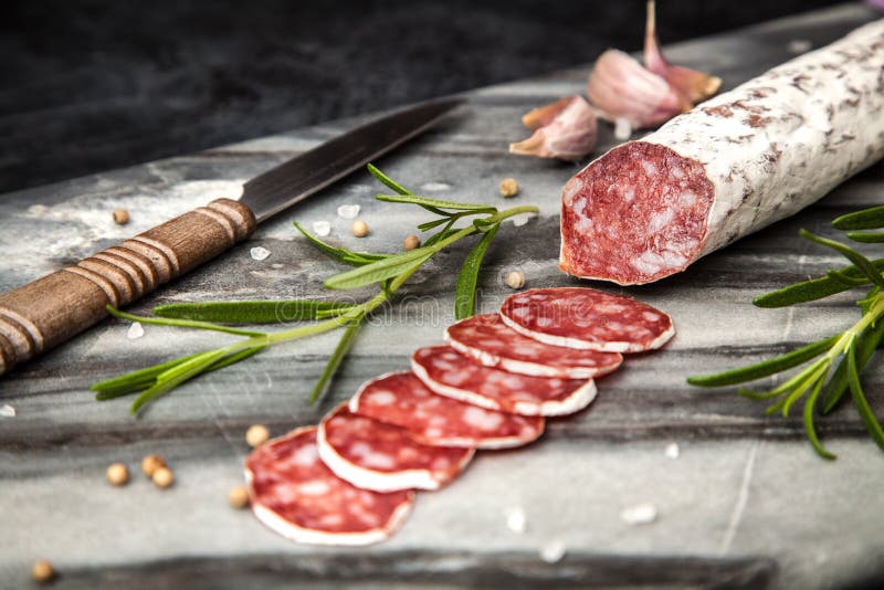 Salami on dark background stock photo. Image of meal 78996730