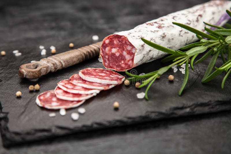 Salami on dark background