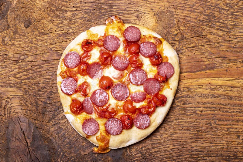 Salami pizza stock image. Image of eating, junk, bake 265785633