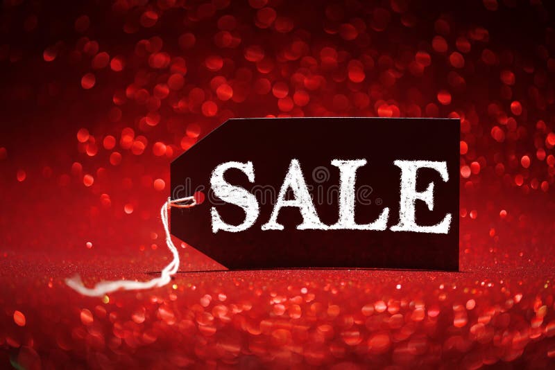 Sale Price Tag on Red Glitter Background Stock Photo - Image of sign