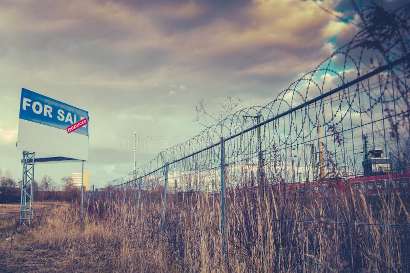 For Sale Sign On Urban Wasteland