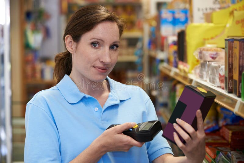 Sales Assistant Checking Stock Levels in Supermarket Using Hand he