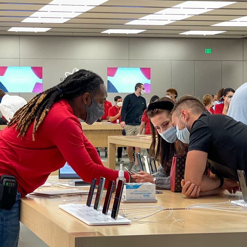 Orlando, FL/USA - 10/25/20: People waiting in line at the Apple retail store  to look at and possibly purchase the new iPhone 12 and 12 Pro smartphones  Stock Photo - Alamy