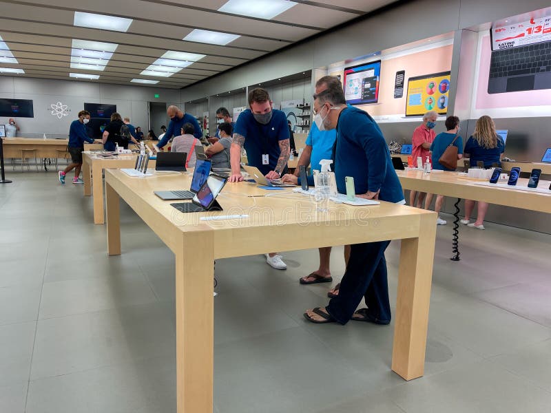 Orlando, FL USA - November 20, 2020: A salesperson and customers at an Apple  store looking at the latest Apple iPhone 12 models for sale Stock Photo -  Alamy