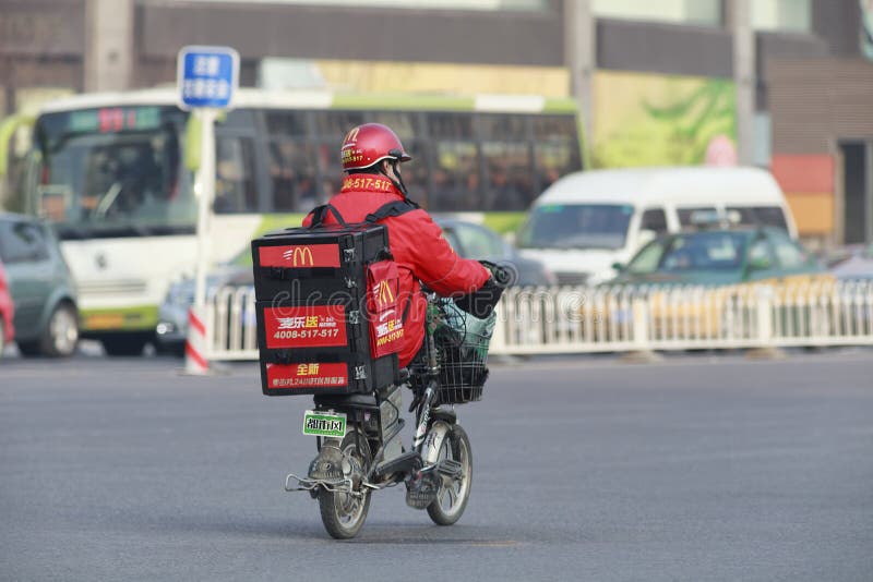 BEIJING-DEC. 4. McDonald delivery on e-bike. It took McDonald 19 years to reach 1,000 restaurants in China and the company plans to double the number to 2,000 outlets by 2013. Beijing, Dec. 4, 2012. BEIJING-DEC. 4. McDonald delivery on e-bike. It took McDonald 19 years to reach 1,000 restaurants in China and the company plans to double the number to 2,000 outlets by 2013. Beijing, Dec. 4, 2012.