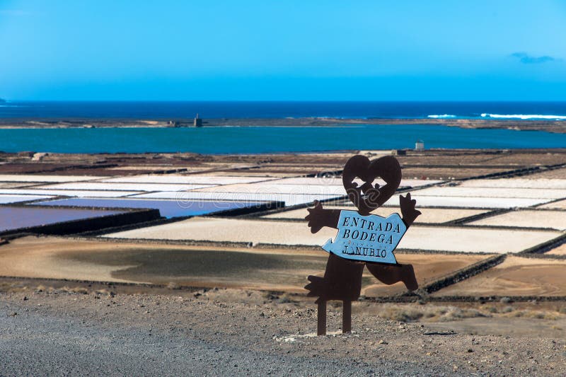 On the south coast of Lanzarote, near the fishing village of El Golfo, is the salt mining plant Salinas de Janubio, which is separated from the open sea by a headland. Aerial view. Canary Islands, Spain, Europe. On the south coast of Lanzarote, near the fishing village of El Golfo, is the salt mining plant Salinas de Janubio, which is separated from the open sea by a headland. Aerial view. Canary Islands, Spain, Europe