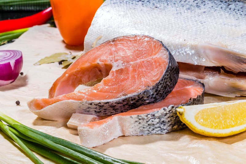 https://thumbs.dreamstime.com/b/salmon-fish-large-chunk-cut-pieces-around-vegetables-fruits-salmon-fish-large-chunk-cut-pieces-166241178.jpg