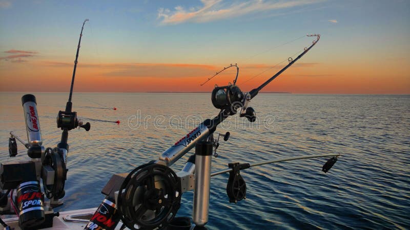 Leland, Michigan, USA - August 2, 2016: Downriggers on salmon fishing boat off the coast of Leland. Leland, Michigan, USA - August 2, 2016: Downriggers on salmon fishing boat off the coast of Leland.