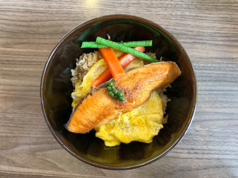 Salmon Grilled and Egg Omelette with Rice on the Table Stock Photo