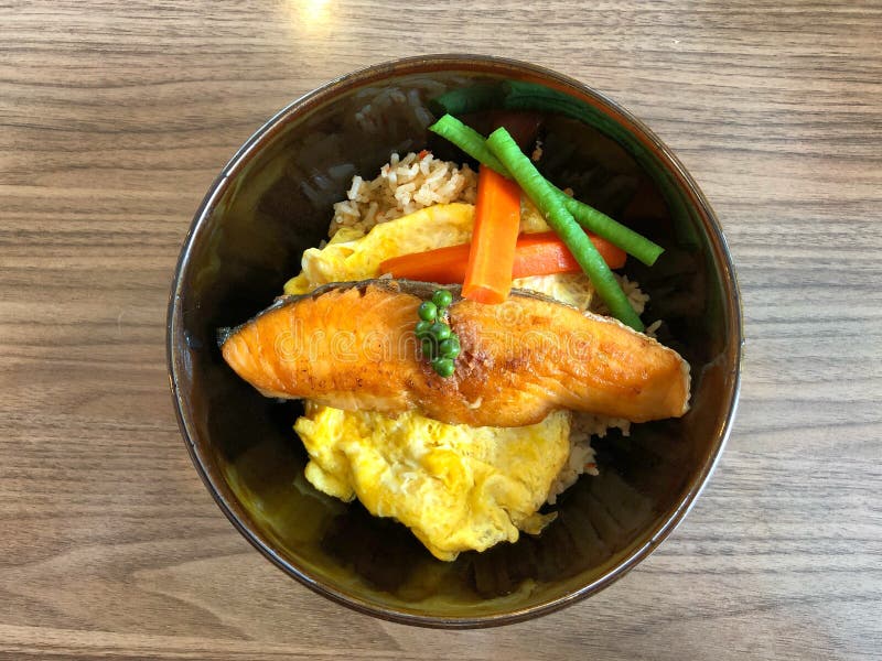 Salmon Grilled and Egg Omelette with Rice on the Table Stock Photo