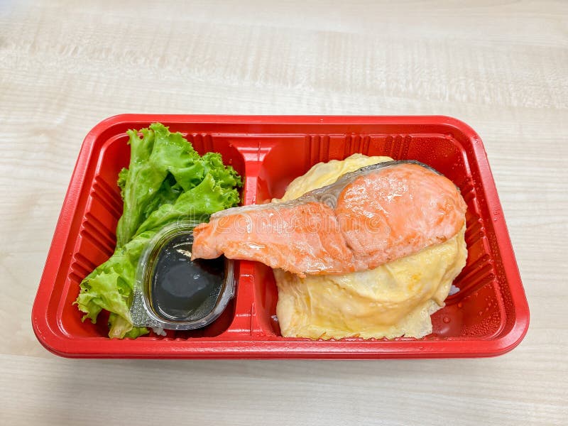 Salmon Grilled with Salad in the Food Container Stock Photo - Image of ...