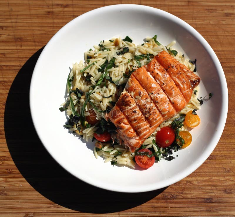 Salmon and Orzo stock image. Image of fish, chef, tomatoes 42627943
