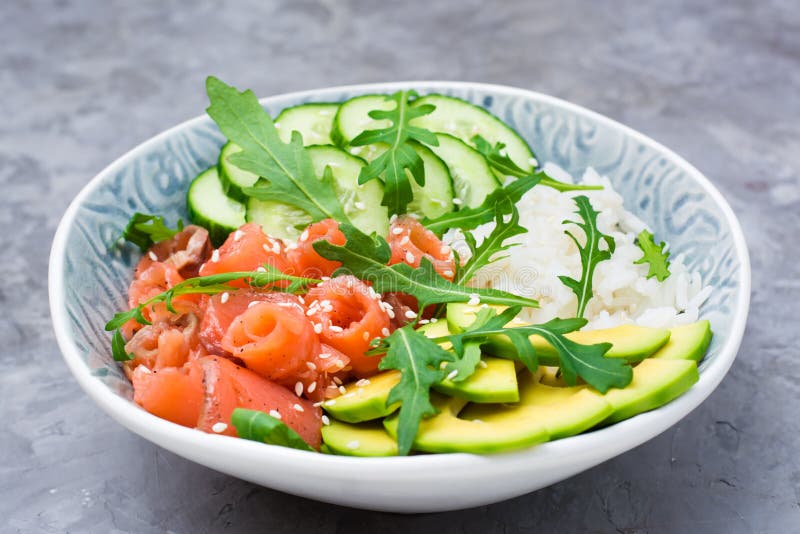 Salmon Poke with Avocado, Arugula and Cucumber in a Bowl Stock Image Image of bowl, plate