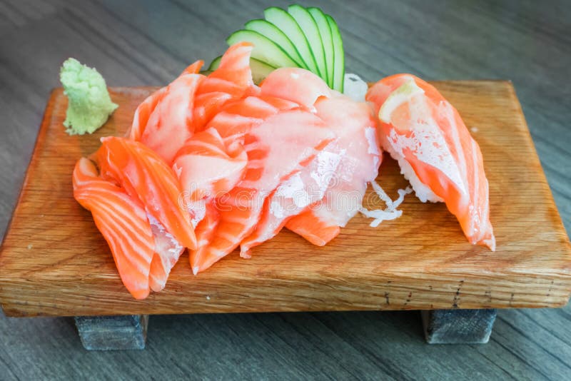 Salmon raw sashimi on wooden table Japanese traditional dish royalty free stock photo Salmon raw sashimi on wooden table Japanese traditional dish royalty free stock photo
