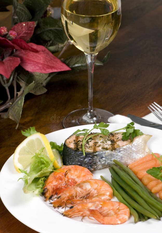Salmon and Shrimp with wine stock images