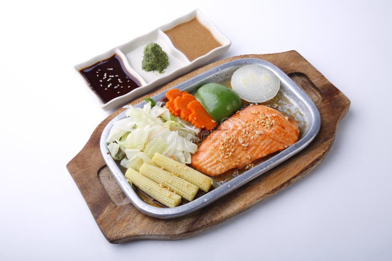 Salmon Steak on Hot Plate with Three Sauce Isolated on White Stock