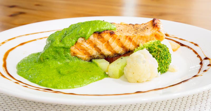 Salmon steak with pesto sauce