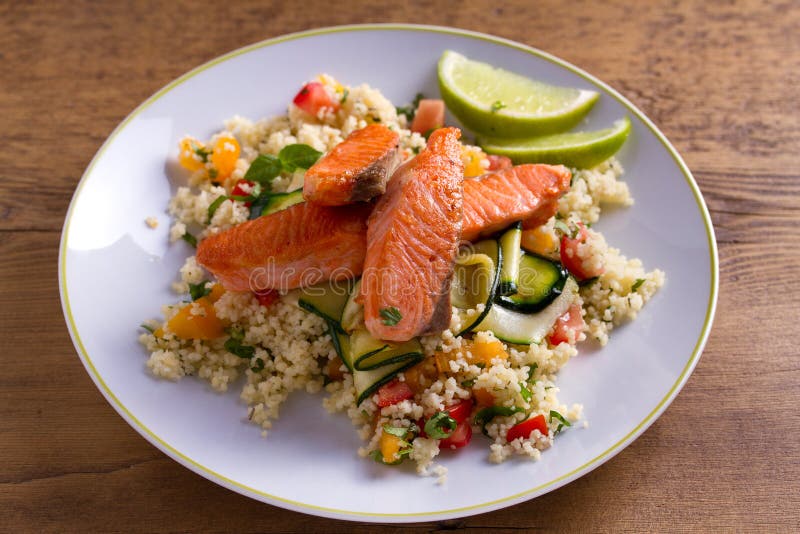 Salmon with Tomato Couscous, Zucchini and Lime. Stock Image Image of