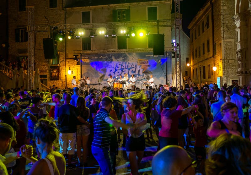 Salsa Beach Splash Festival in Sibenik. Sibenik, Croatia - July 6, 2018: Dancing crowd of people at Salsa Beach Splash Festival in Sibenik