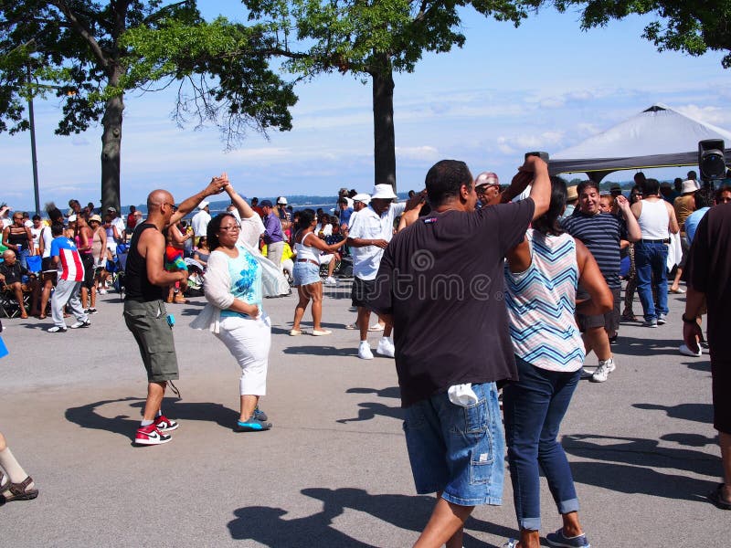 Every Sunday in the summer time hundreds of people gather at Orchard beach in the Bronx for Salsa dancing at the Beach. Every Sunday in the summer time hundreds of people gather at Orchard beach in the Bronx for Salsa dancing at the Beach