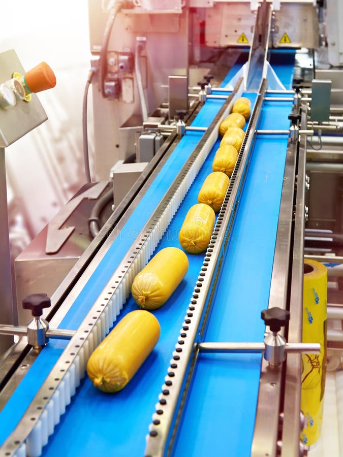 Sausages on a conveyor belt at a food factory. Sausages on a conveyor belt at a food factory