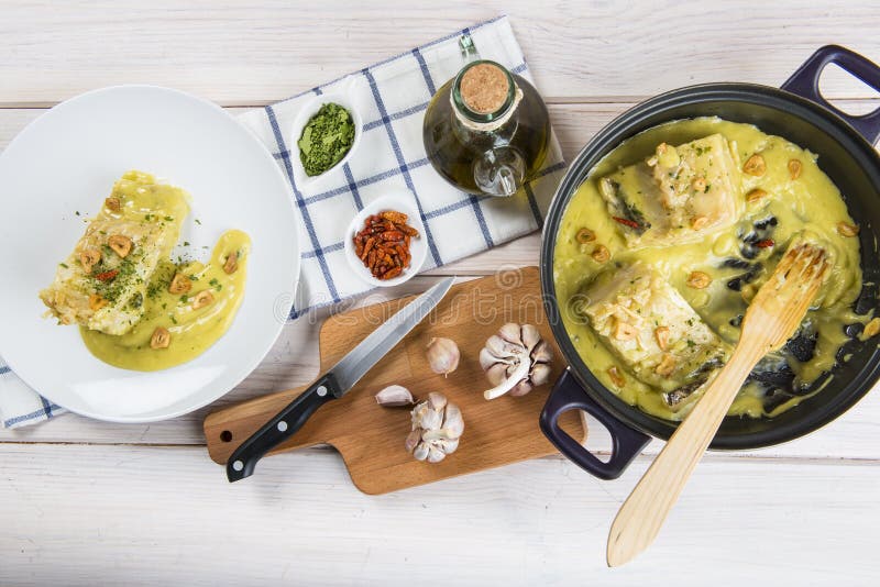 Salt cod in a pilpil sauce stock photo. Image of sauce 71931430