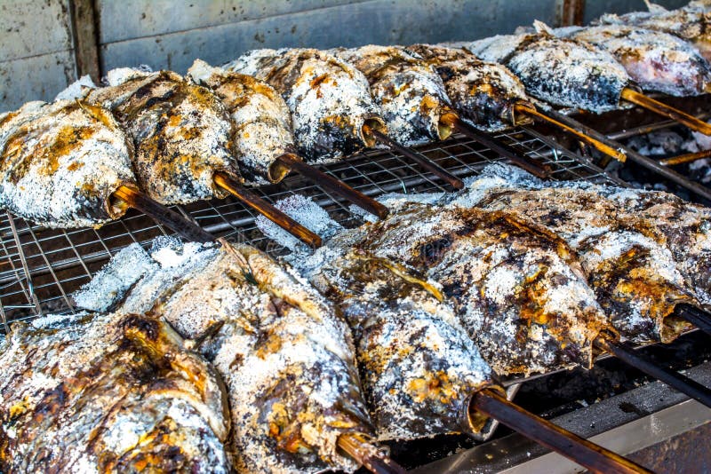SaltCrusted Grilled Fish Eaten with Seafood Sauce. Stock Image Image