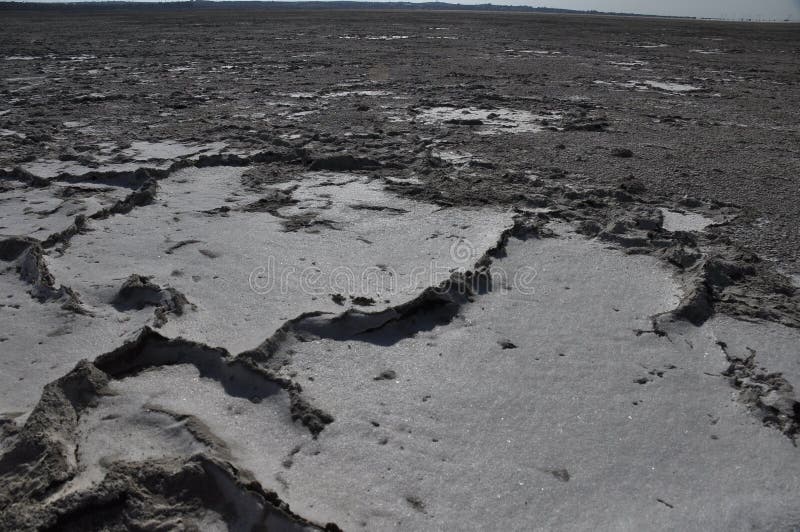 Salt dry and cracked lake Akrotiri in Cyprus stock photos