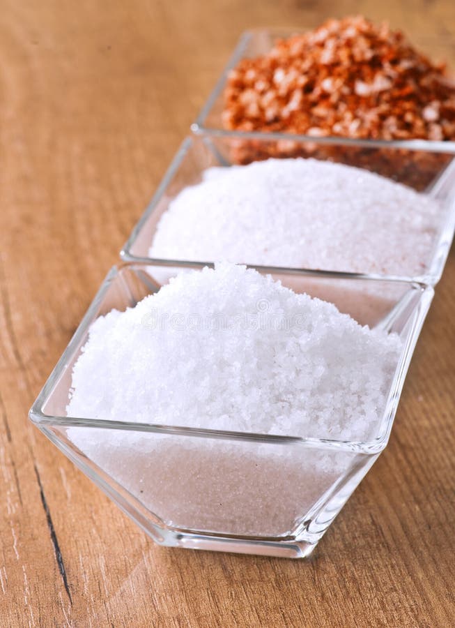 Salt flakes in small bowl stock photo. Image of pink 25411600