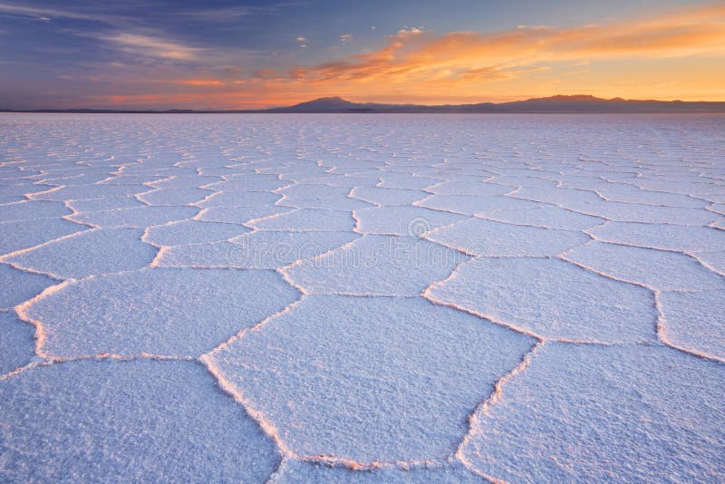 Salt flat Salar de Uyuni in Bolivia at sunrise