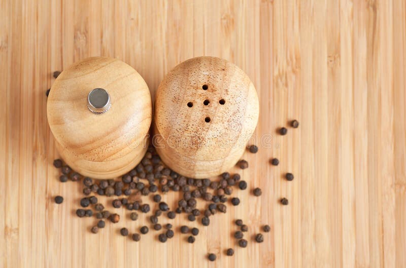 Salt and pepper grinders on a table