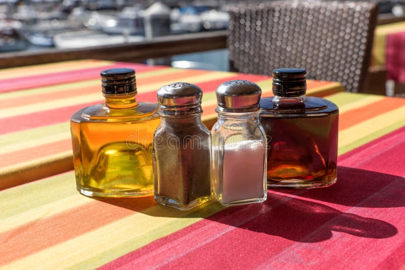 Salt, Pepper, Olive Oil and Balsamic Vinegar on the Table Stock Image