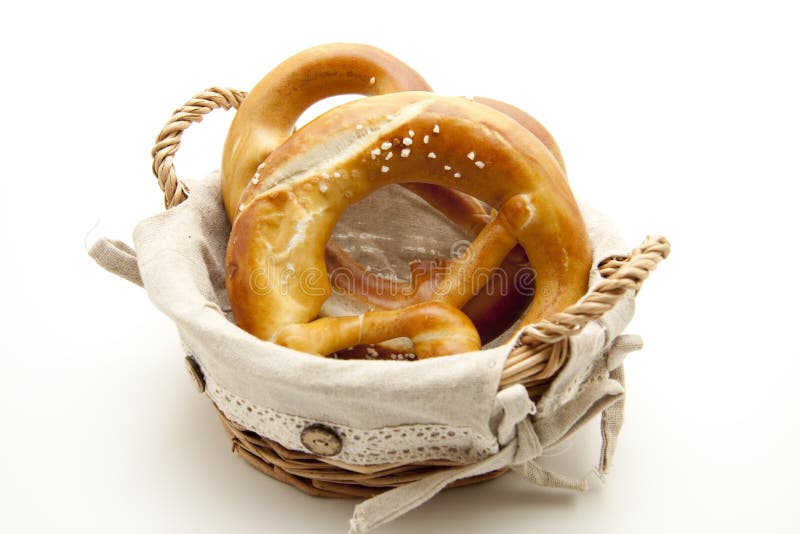 Salt pretzel in the basket stock photo. Image of isolated 16983074