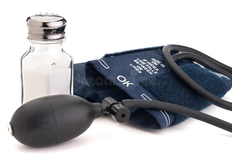 Salt shaker and blood pressure cuff stock photo