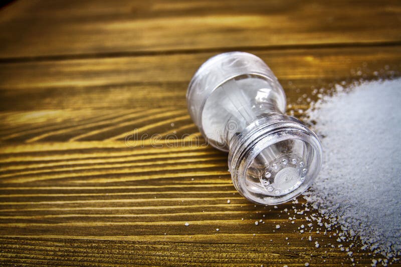 Wooden salt shaker and pepperbox on a light background. Stock Photo by  ©ellymorena 238801336