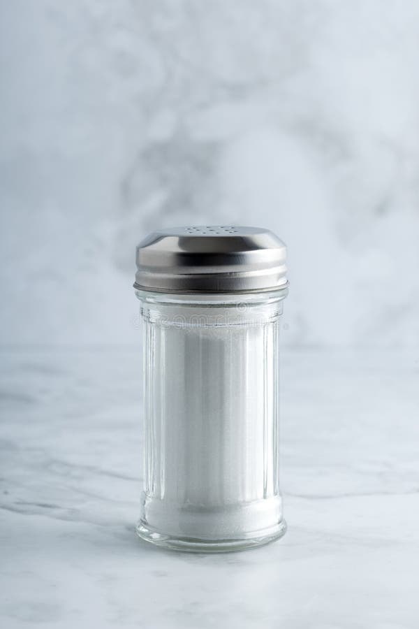 Salt shaker on marble countertop royalty free stock images