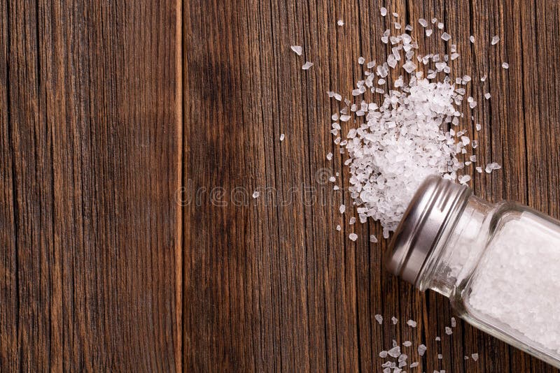 Wooden salt shaker and pepperbox on a light background. Stock Photo by  ©ellymorena 238801336