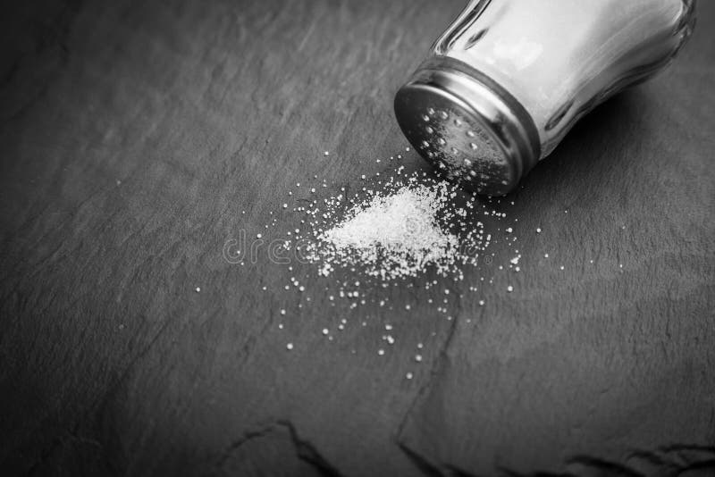 Salt shaker on slate board stock photo. Image of crystal 76464608