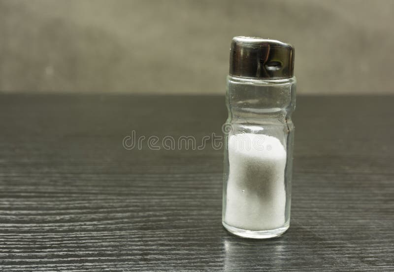 Salt shaker on the table. stock photo. Image of food 107676126