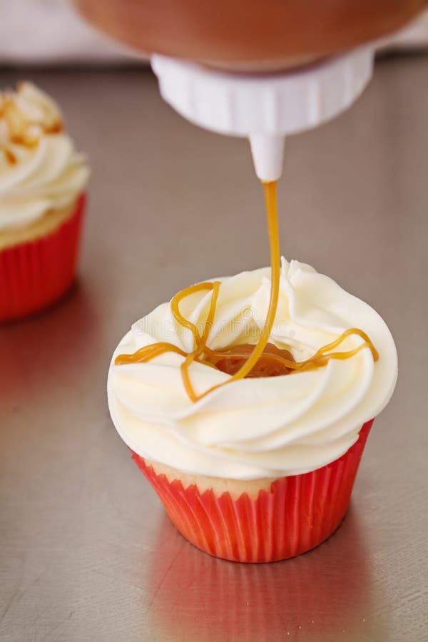 Salted Caramel Topping on Vanilla Cupcake Stock Photo Image of