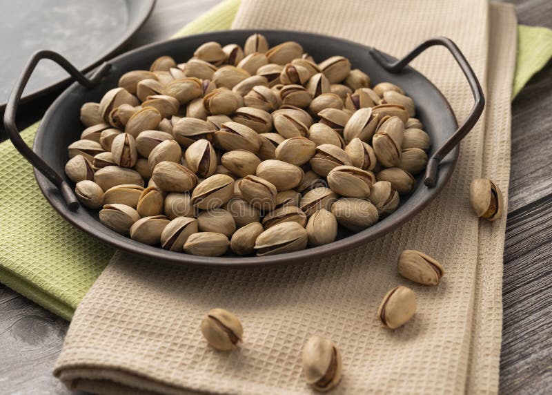 Salted pistachios on a tray served on a table. Pistachios served stock images, royalty-free photos and pictures