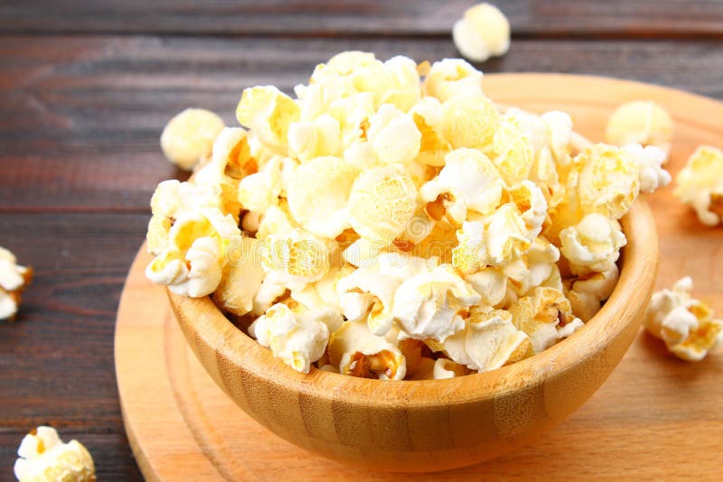 Salted Popcorn in a Wooden Bowl on a Wooden Table. Stock Image Image