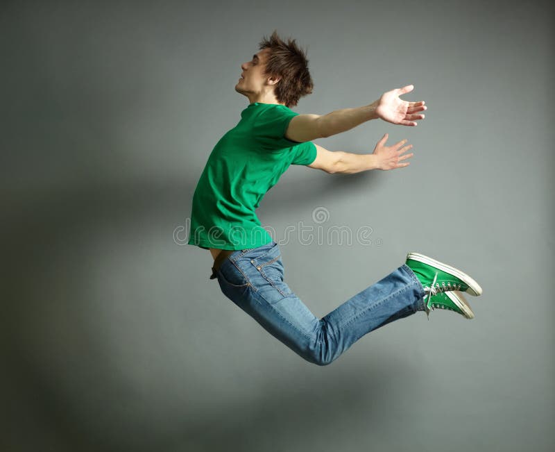 Artistic shot of a guy jumping high and posing meanwhile. Artistic shot of a guy jumping high and posing meanwhile