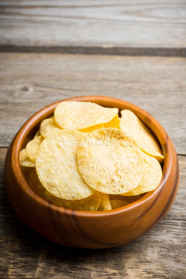 Salty Chips On The Rustic Background Stock Photo Image of crisp
