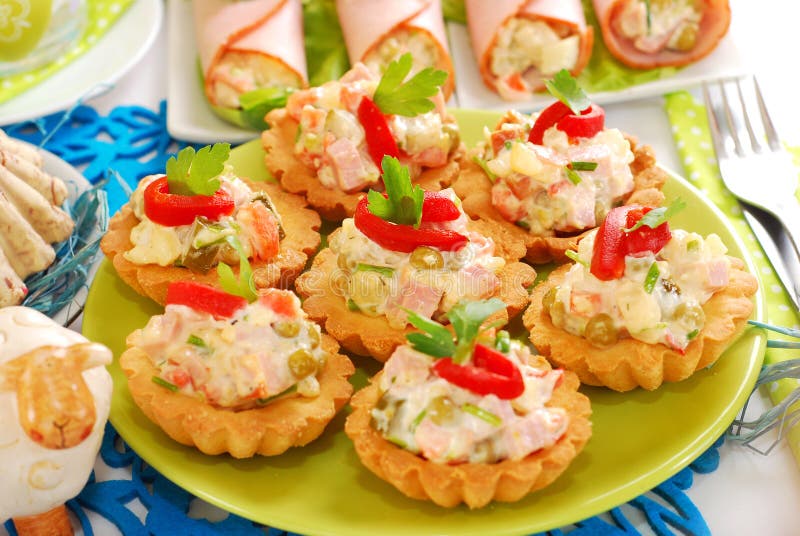Salty Mini Tartlets Stuffed with Vegetable and Ham Salad Stock Photo