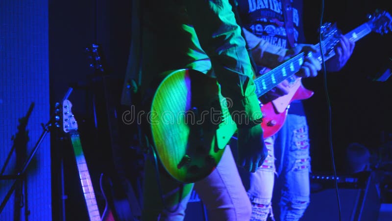 Guitarists on stage play guitars