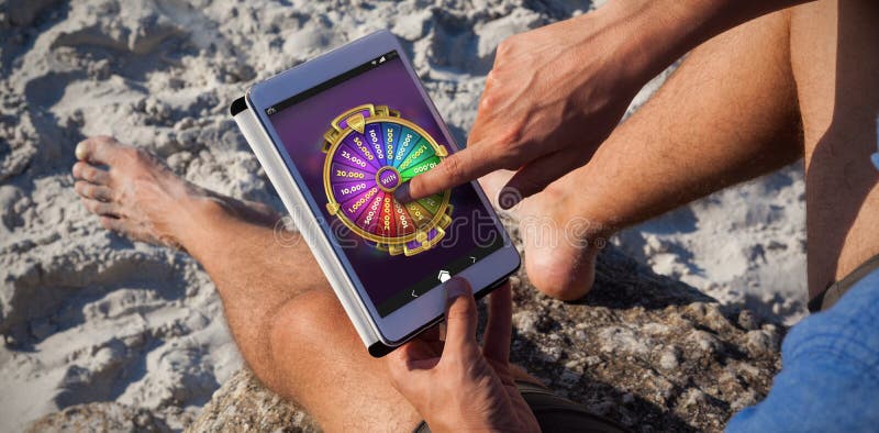 Samengesteld beeld van multi gekleurd fortuin van wiel op mobiele vertoning stock afbeelding Samengesteld beeld van multi gekleurd fortuin van wiel op mobiele vertoning stock afbeelding